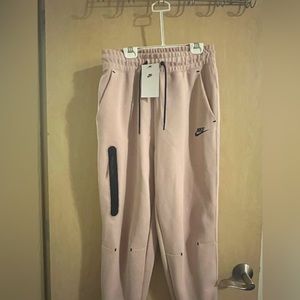 Pink Nike tech sweatpants comfortable, yet fitted